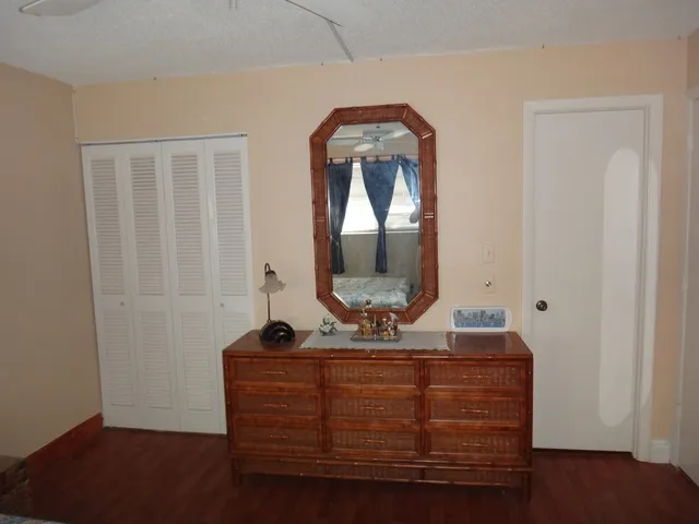 Master bedroom dresser, closet, and bathroom.