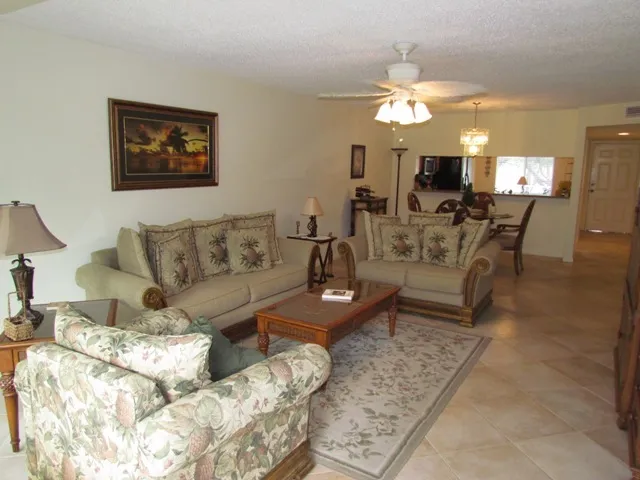 Living/Dining room combo with Tommy Bahama furnishings.