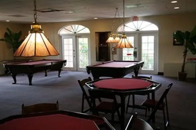 The Game Room with leather sofas and large screen TV