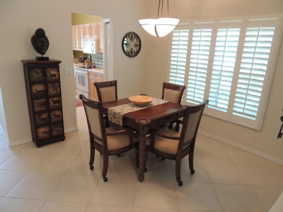 Lots of windows, tile / hardwood floors through out / custom shutters & more