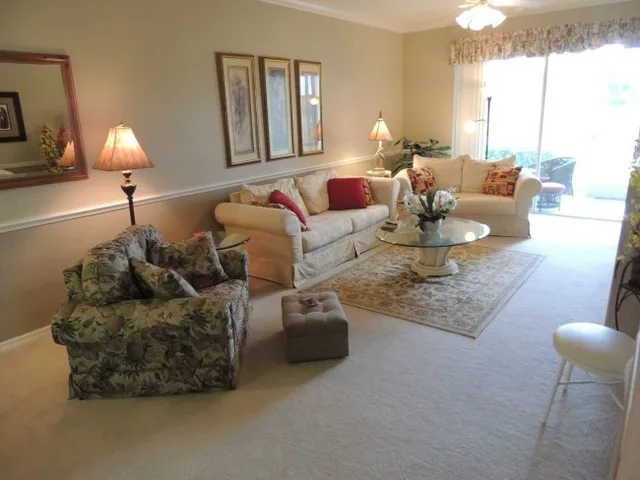 Greatroom is an over-sized living room w/ flat screen tv & leads to lanai