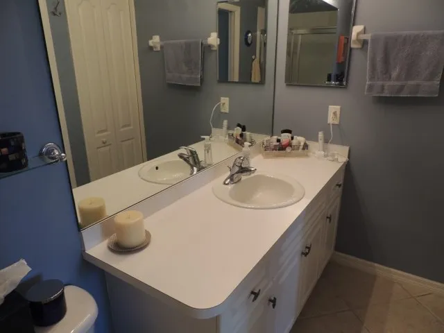 Master bath with a walk in shower