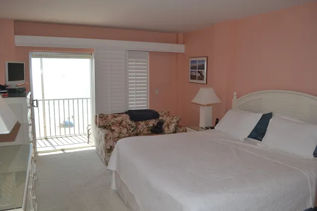 Master bedroom, king bed, LCD tv, two dressers, and loveseat.