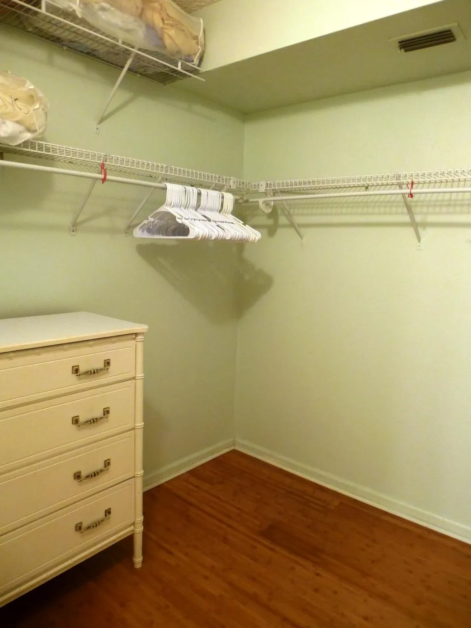 Walk in closet in master bedroom.