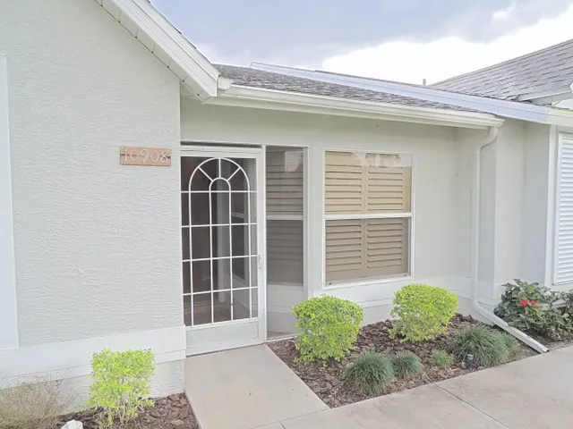 This villa has 2 bedrooms, 2 baths, a den & a glass enclosed lanai - completely renovated!