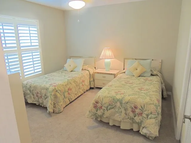 Guest room features twin beds