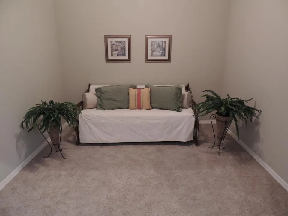 The den has a day bed that is perfect for relaxing or can be turned into two twin beds for guests