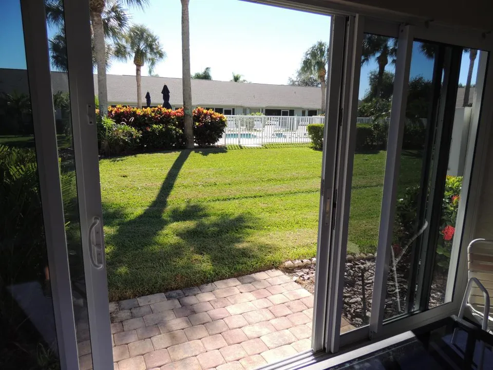 Access to the pool from your lanai!! Brick paver deck perfect for private sun bathing!