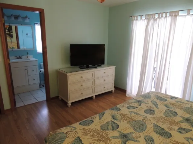 The master bedroom also has a flat screen tv, large closet, and private bath