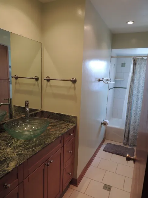 The guest bath room has been renovated with granite & has a tub/shower combo