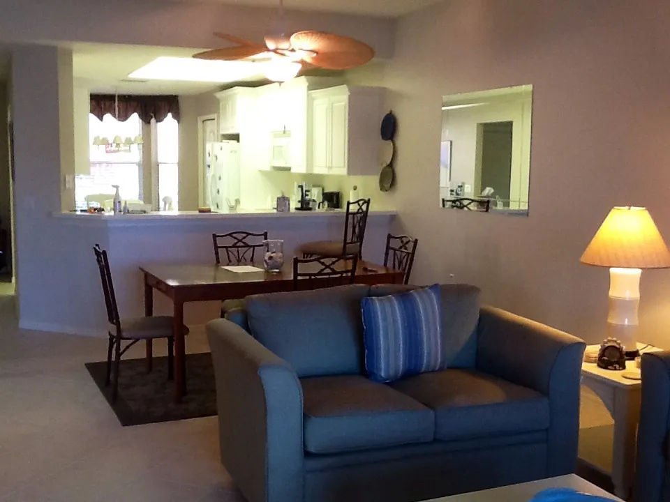 Open floor plan kitchen dining area living room overlooking the lake