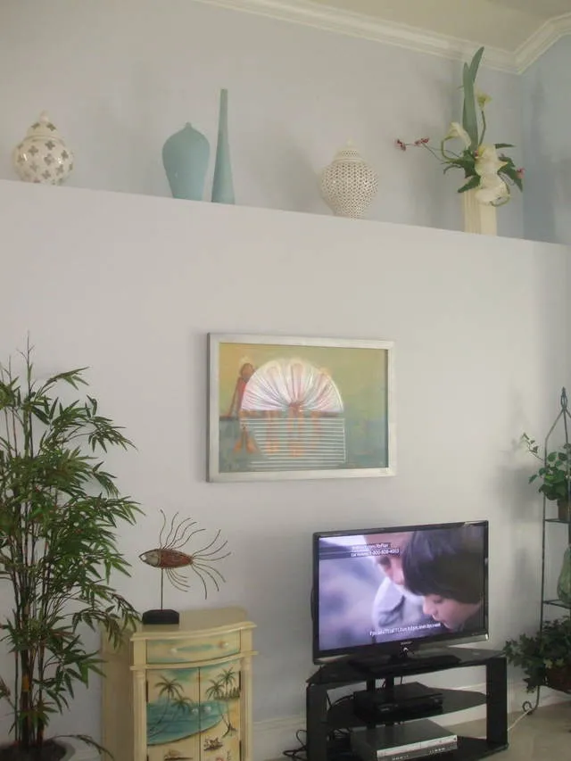 Newly painted living room is very bright with high celings.