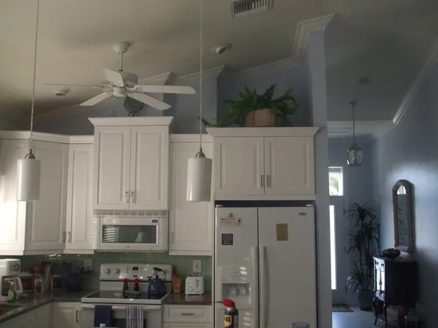 New kitchen has lazy susan and pull out shelves.