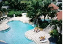 Waterfall pool with shallow end and zero entry area for little ones.
