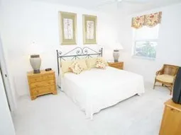 King sized master suite with private bath, 2 sinks, and access to lanai.