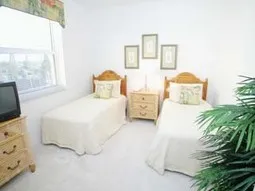 Twin bedroom with TV.