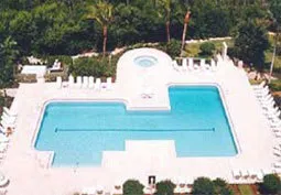 Pool and deck with lounge chairs to spare