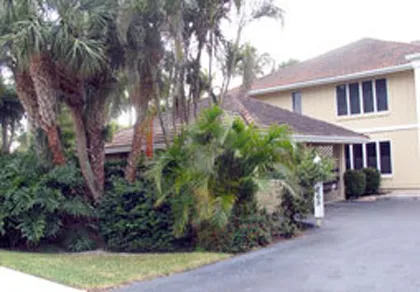 Front entrance to condo and your covered garage from 3rd St S at 5th Ave S.
