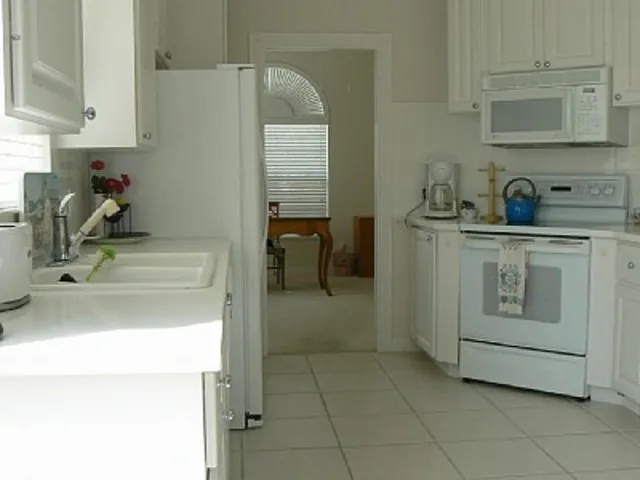 Light bright kitchen looking into Office with hi speed internet