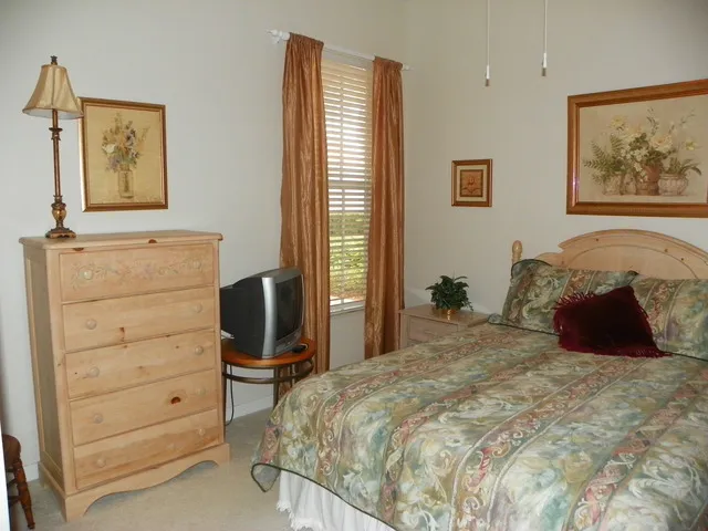 3rd bedroom, queen bed, closet, bath across the hall