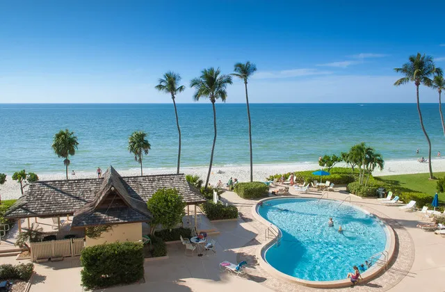 View of large pool and lounge area from balcony.