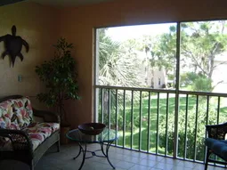Lanai with new wicker furniture. Lanai overlooks garden area. 