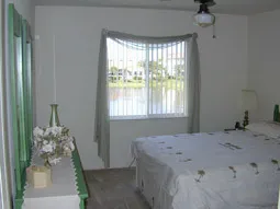 Relax in this quaint yet roomy bedroom.