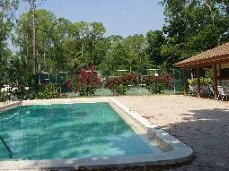 Relax or BBQ by your choice of two pools or play tennis by the main pool