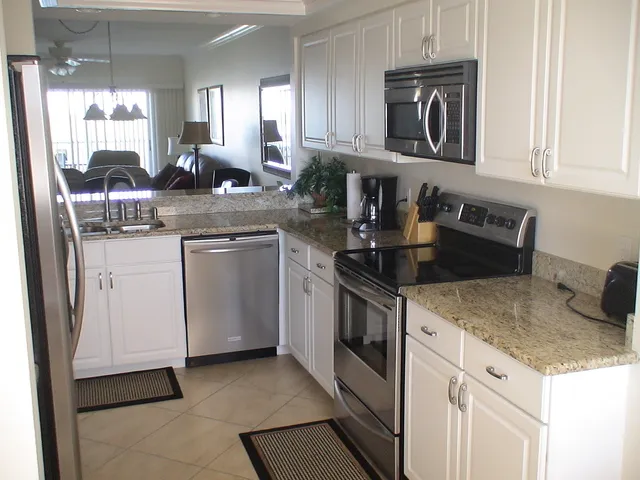 Gourmet kitchen complete with granite counters & stainless steel appliances