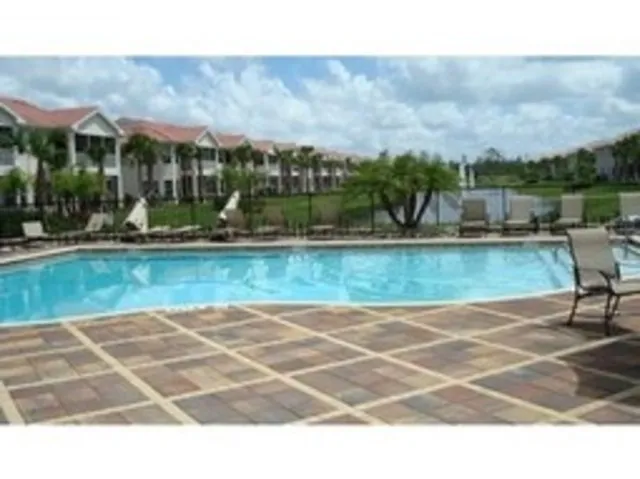 Clubhouse pool area overlooking lake