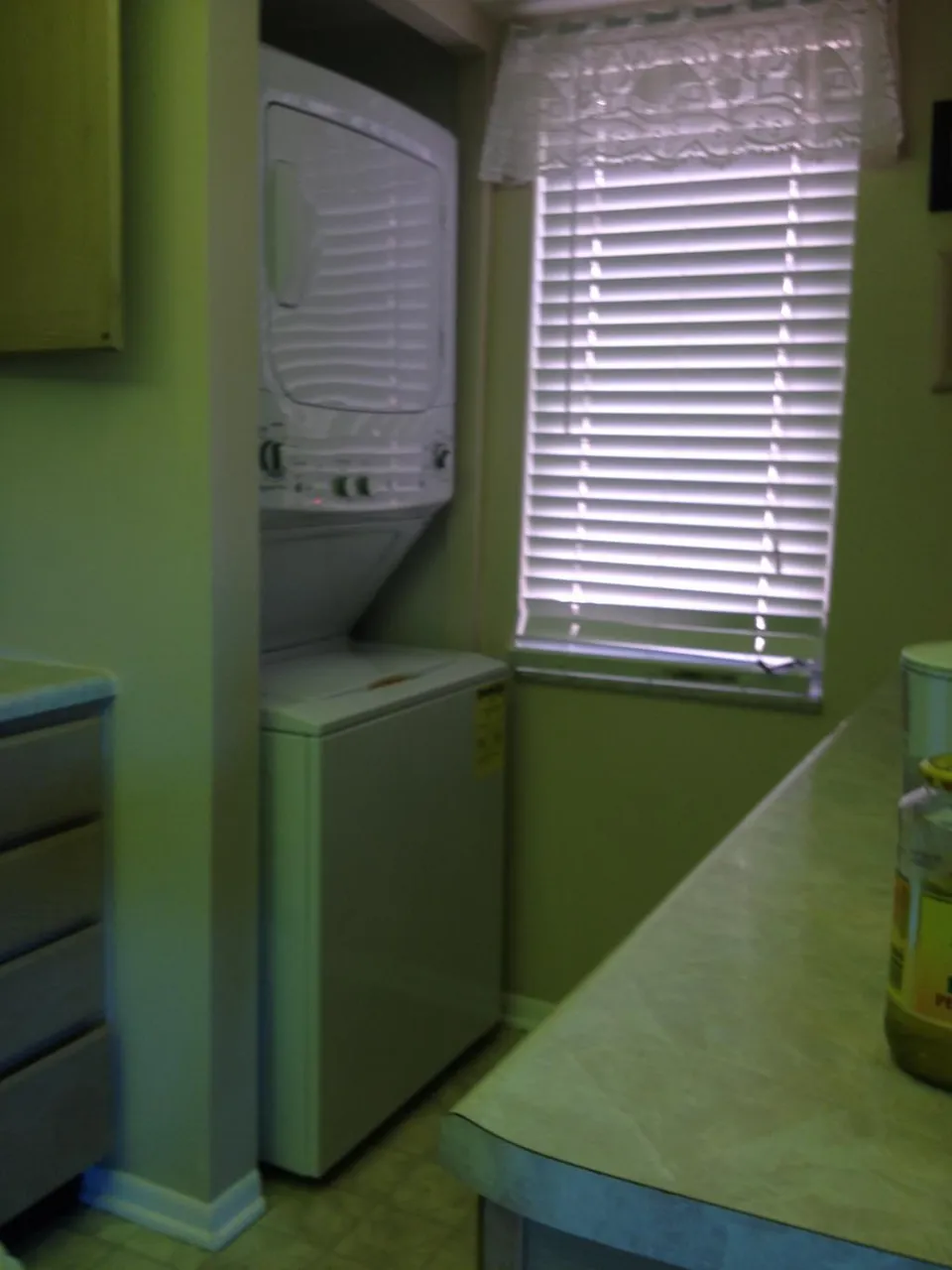 KITCHEN HAS A STACKED WASHER/DRYER