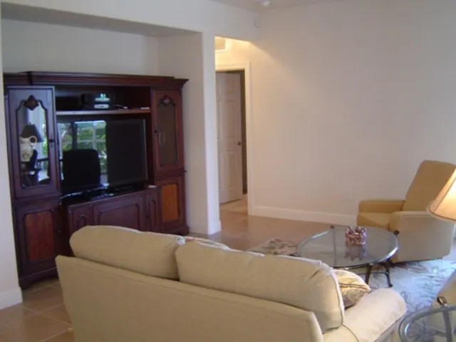 LIVING ROOM WITH BIG SCREEN TV