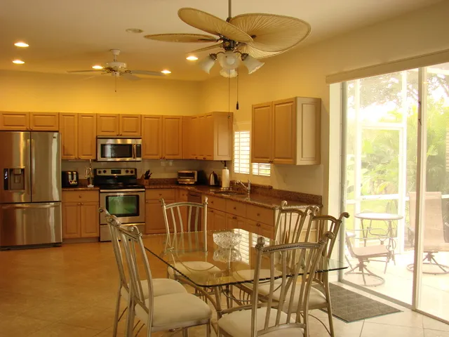 Kitchen with dining area - sliders to the lanai area 