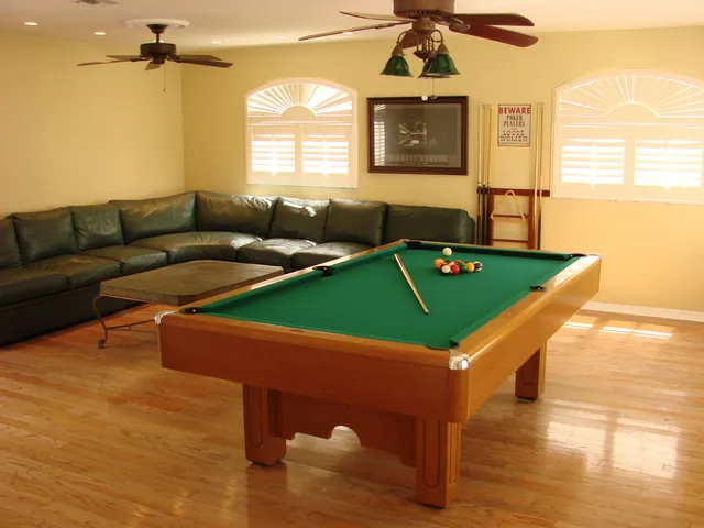 The game room is perfect for the whole family! Pool table and large leather sectional