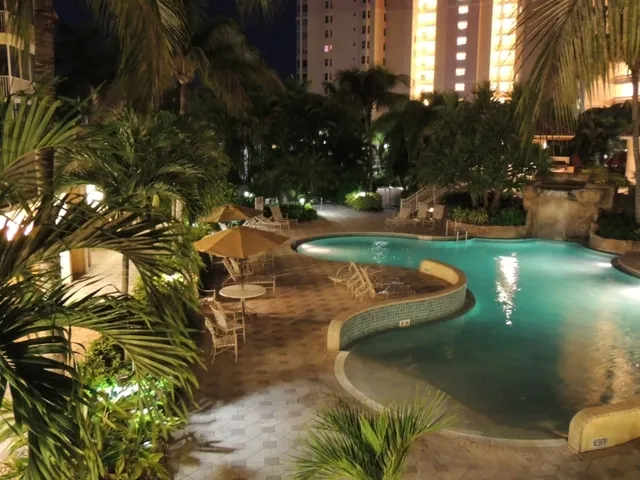 Resort pool w/waterfall, spa, kiddie pools, grill area, fitness room....