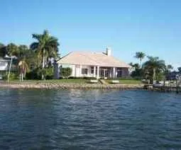 Rear of house and dock from Naples bay looking to the East.