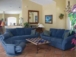 Living Room/Salon opens to pool and lanai. TV, VCR, DVD, Stereo System.