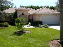 Beautiful four bedroom home on a Royal Palm tree lined street.