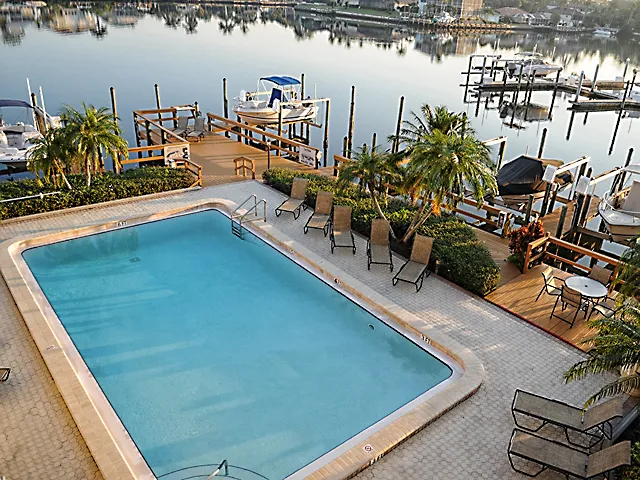 Our heated pool sits directly on the bay with ample space for sunbathing.