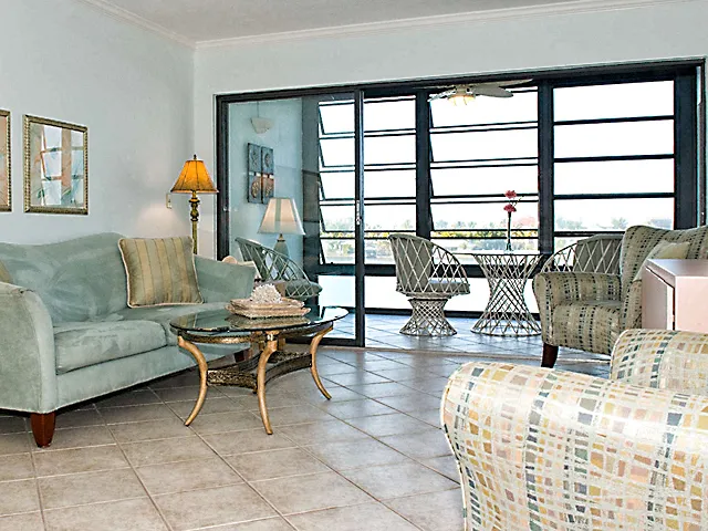 Livingroom and Lanai looks out on Vanderbilt Bay. Complete remodel in 2008.