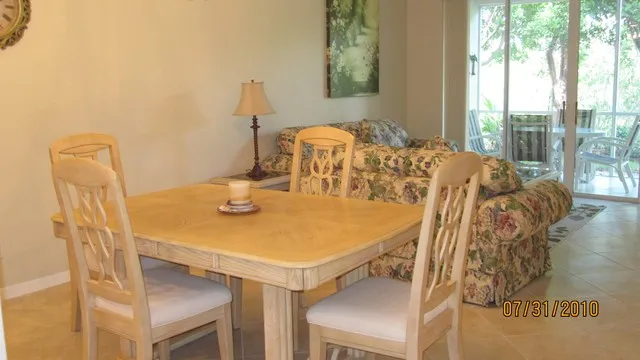 Living room, dining room, lanai with table 