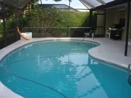 Pool deck/lanai with outdoor gas grill