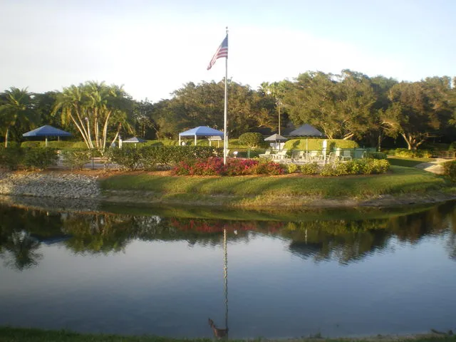 View of one of the  four lakes of the Estate +  pool at the back