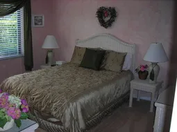 Master bedroom with attached bath has sliding door to lanai