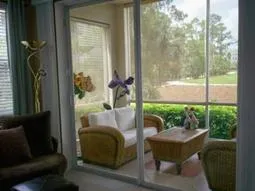Screened lanai with view of 5th green and lakes