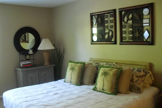 The master suite, complete with french doors out to the lanai.