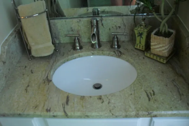 New granite, sink and faucet in gues bath...it's lovely!