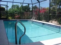 Private Heated Pool Eat outside & sun with views of the tropical landscape.