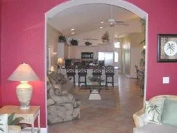 Look into the home or out to the pool from this lovely "Florida Room".