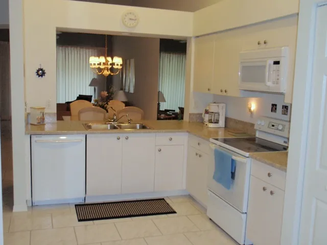 Kitchen with new countertops, dishwasher and microwave oven